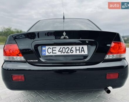 Чорний Міцубісі Lancer, об'ємом двигуна 1.6 л та пробігом 243 тис. км за 4950 $, фото 10 на Automoto.ua