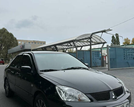 Черный Мицубиси Лансер, объемом двигателя 1.58 л и пробегом 254 тыс. км за 5000 $, фото 27 на Automoto.ua