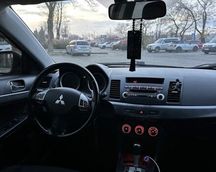 Черный Мицубиси Лансер, объемом двигателя 2 л и пробегом 242 тыс. км за 6200 $, фото 14 на Automoto.ua