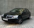 Чорний Міцубісі Lancer, об'ємом двигуна 1.58 л та пробігом 135 тис. км за 4100 $, фото 1 на Automoto.ua