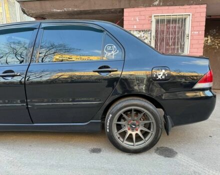 Черный Мицубиси Лансер, объемом двигателя 1.6 л и пробегом 211 тыс. км за 5600 $, фото 2 на Automoto.ua