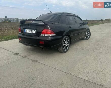 Чорний Міцубісі Lancer, об'ємом двигуна 1.6 л та пробігом 310 тис. км за 5100 $, фото 16 на Automoto.ua