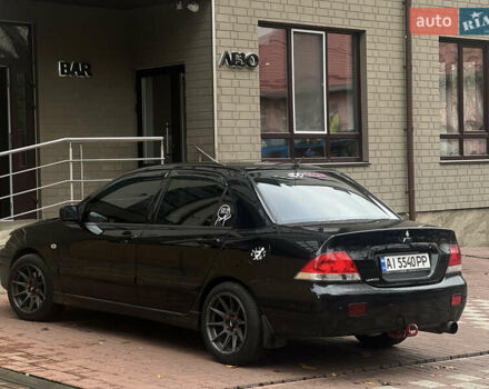 Черный Мицубиси Лансер, объемом двигателя 1.6 л и пробегом 211 тыс. км за 5700 $, фото 39 на Automoto.ua