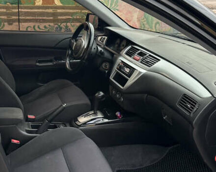 Черный Мицубиси Лансер, объемом двигателя 2 л и пробегом 143 тыс. км за 4999 $, фото 5 на Automoto.ua