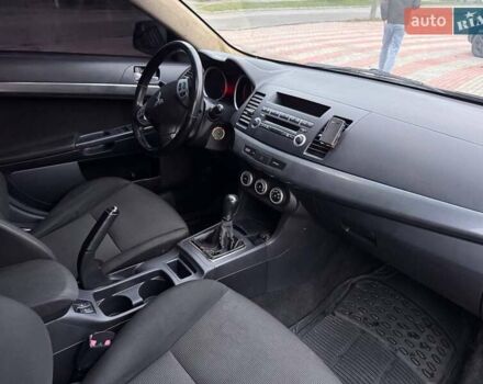 Черный Мицубиси Лансер, объемом двигателя 2 л и пробегом 217 тыс. км за 5500 $, фото 8 на Automoto.ua