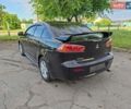 Чорний Міцубісі Lancer, об'ємом двигуна 2 л та пробігом 173 тис. км за 8800 $, фото 1 на Automoto.ua
