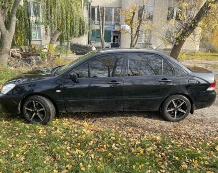 Міцубісі Lancer 2007 у Каневе на Automoto.ua Чорний Міцубісі Lancer, об'ємом двигуна 1.6 л та пробігом 310 тис. км за 4100 $, фото 1 на Automoto.ua