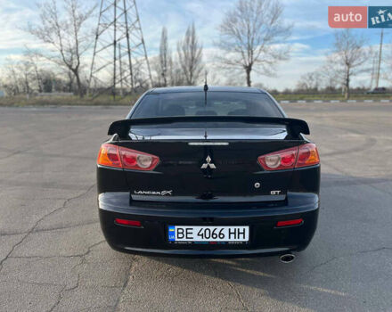 Черный Мицубиси Лансер, объемом двигателя 2 л и пробегом 193 тыс. км за 7500 $, фото 3 на Automoto.ua