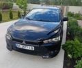 Черный Мицубиси Лансер, объемом двигателя 2 л и пробегом 218 тыс. км за 6000 $, фото 1 на Automoto.ua