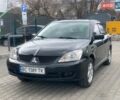 Черный Мицубиси Лансер, объемом двигателя 1.6 л и пробегом 240 тыс. км за 3800 $, фото 1 на Automoto.ua