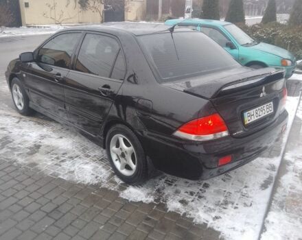 Черный Мицубиси Лансер, объемом двигателя 1 л и пробегом 2 тыс. км за 2700 $, фото 2 на Automoto.ua