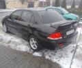 Черный Мицубиси Лансер, объемом двигателя 1 л и пробегом 2 тыс. км за 2700 $, фото 2 на Automoto.ua