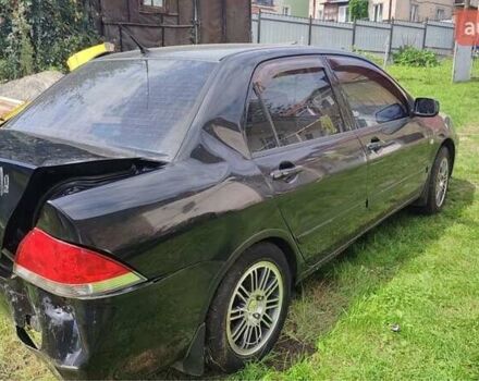 Чорний Міцубісі Lancer, об'ємом двигуна 1.6 л та пробігом 22 тис. км за 1700 $, фото 6 на Automoto.ua