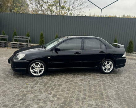 Чорний Міцубісі Lancer, об'ємом двигуна 2 л та пробігом 210 тис. км за 5500 $, фото 1 на Automoto.ua