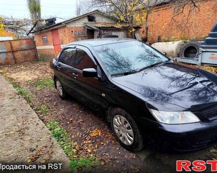 Черный Мицубиси Лансер, объемом двигателя 1.6 л и пробегом 171 тыс. км за 4350 $, фото 1 на Automoto.ua