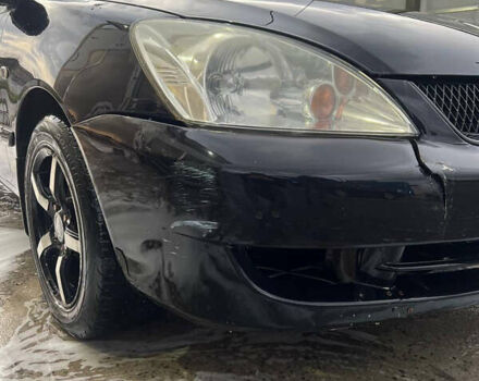 Черный Мицубиси Лансер, объемом двигателя 1.6 л и пробегом 180 тыс. км за 3499 $, фото 1 на Automoto.ua