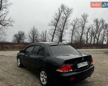 Черный Мицубиси Лансер, объемом двигателя 1.6 л и пробегом 272 тыс. км за 2800 $, фото 10 на Automoto.ua