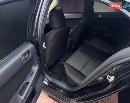 Черный Мицубиси Лансер, объемом двигателя 2 л и пробегом 217 тыс. км за 5500 $, фото 10 на Automoto.ua