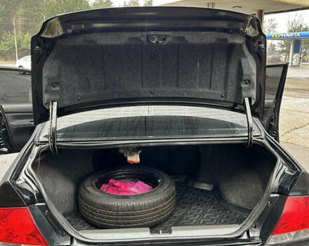 Черный Мицубиси Лансер, объемом двигателя 1.58 л и пробегом 254 тыс. км за 5000 $, фото 25 на Automoto.ua