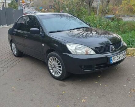 Чорний Міцубісі Lancer, об'ємом двигуна 1.58 л та пробігом 190 тис. км за 3750 $, фото 18 на Automoto.ua