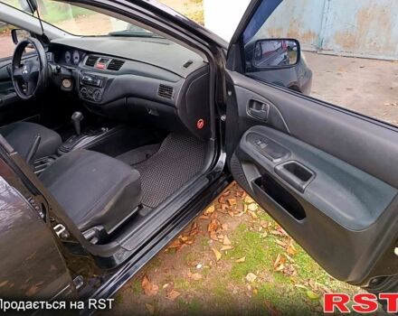 Чорний Міцубісі Lancer, об'ємом двигуна 1.6 л та пробігом 227 тис. км за 4100 $, фото 11 на Automoto.ua