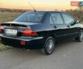 Черный Мицубиси Лансер, объемом двигателя 1.58 л и пробегом 139 тыс. км за 5200 $, фото 17 на Automoto.ua