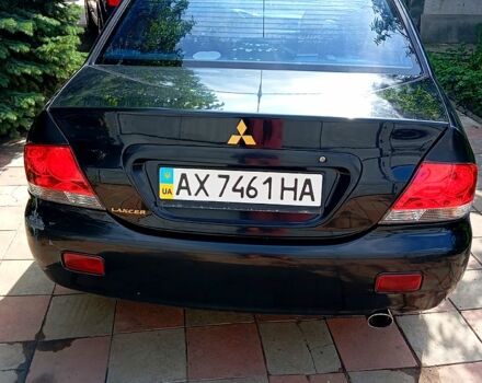 Черный Мицубиси Лансер, объемом двигателя 1.6 л и пробегом 247 тыс. км за 4000 $, фото 4 на Automoto.ua