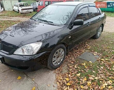 Чорний Міцубісі Lancer, об'ємом двигуна 1.58 л та пробігом 227 тис. км за 4100 $, фото 5 на Automoto.ua