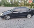 Черный Мицубиси Лансер, объемом двигателя 2 л и пробегом 300 тыс. км за 3200 $, фото 7 на Automoto.ua