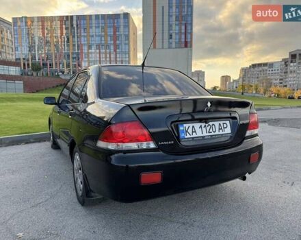 Черный Мицубиси Лансер, объемом двигателя 1.58 л и пробегом 237 тыс. км за 3950 $, фото 4 на Automoto.ua