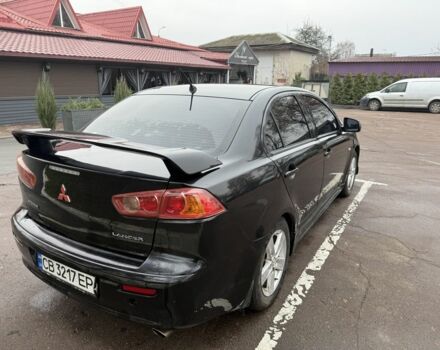 Черный Мицубиси Лансер, объемом двигателя 2 л и пробегом 281 тыс. км за 6000 $, фото 5 на Automoto.ua