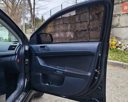 Черный Мицубиси Лансер, объемом двигателя 2 л и пробегом 230 тыс. км за 7100 $, фото 6 на Automoto.ua