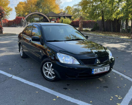 Чорний Міцубісі Lancer, об'ємом двигуна 1.58 л та пробігом 175 тис. км за 5200 $, фото 4 на Automoto.ua