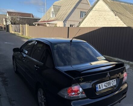 Черный Мицубиси Лансер, объемом двигателя 2 л и пробегом 220 тыс. км за 5250 $, фото 2 на Automoto.ua