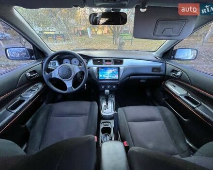 Черный Мицубиси Лансер, объемом двигателя 2 л и пробегом 280 тыс. км за 5400 $, фото 10 на Automoto.ua