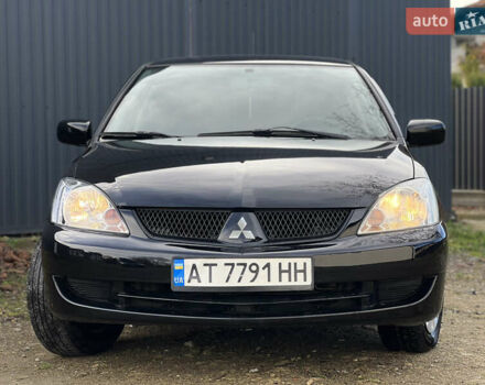 Чорний Міцубісі Lancer, об'ємом двигуна 1.58 л та пробігом 185 тис. км за 3750 $, фото 1 на Automoto.ua