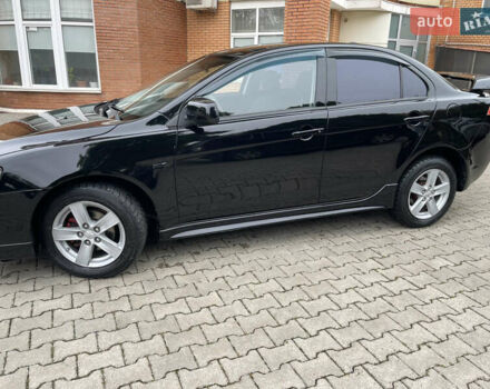 Черный Мицубиси Лансер, объемом двигателя 2 л и пробегом 200 тыс. км за 6199 $, фото 2 на Automoto.ua