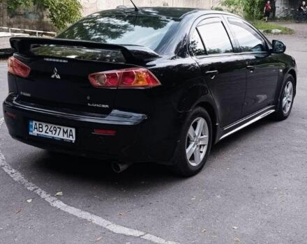 Черный Мицубиси Лансер, объемом двигателя 2 л и пробегом 210 тыс. км за 6000 $, фото 2 на Automoto.ua