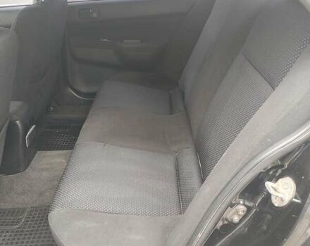 Чорний Міцубісі Lancer, об'ємом двигуна 1.58 л та пробігом 190 тис. км за 3750 $, фото 14 на Automoto.ua
