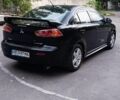 Черный Мицубиси Лансер, объемом двигателя 2 л и пробегом 210 тыс. км за 6000 $, фото 2 на Automoto.ua