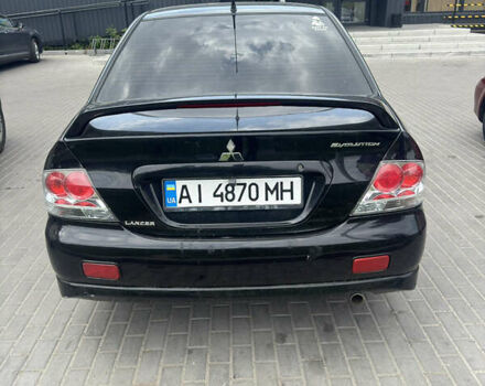 Чорний Міцубісі Lancer, об'ємом двигуна 2 л та пробігом 210 тис. км за 5500 $, фото 35 на Automoto.ua