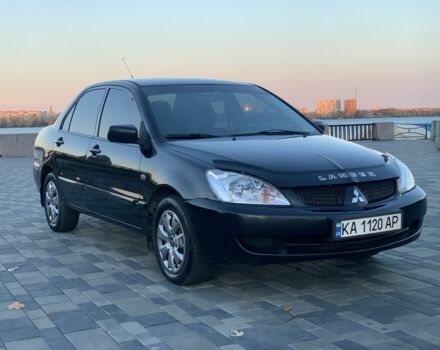 Черный Мицубиси Лансер, объемом двигателя 1.6 л и пробегом 237 тыс. км за 4300 $, фото 1 на Automoto.ua