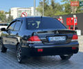 Чорний Міцубісі Lancer, об'ємом двигуна 1.58 л та пробігом 191 тис. км за 4899 $, фото 5 на Automoto.ua