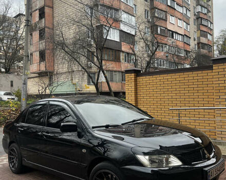 Черный Мицубиси Лансер, объемом двигателя 1.6 л и пробегом 211 тыс. км за 5700 $, фото 7 на Automoto.ua