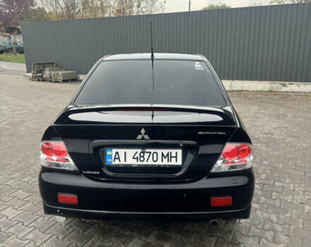 Чорний Міцубісі Lancer, об'ємом двигуна 2 л та пробігом 210 тис. км за 5500 $, фото 9 на Automoto.ua