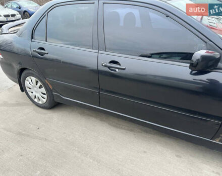 Черный Мицубиси Лансер, объемом двигателя 1.58 л и пробегом 290 тыс. км за 3000 $, фото 3 на Automoto.ua