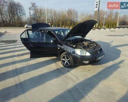 Чорний Міцубісі Lancer, об'ємом двигуна 1.59 л та пробігом 180 тис. км за 4999 $, фото 14 на Automoto.ua