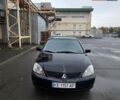 Мицубиси Лансер 2007 в Кривом Роге на Automoto.ua Черный Мицубиси Лансер, объемом двигателя 1.6 л и пробегом 200 тыс. км за 4900 $, фото 2 на Automoto.ua