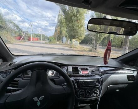 Черный Мицубиси Лансер, объемом двигателя 1.6 л и пробегом 244 тыс. км за 4500 $, фото 8 на Automoto.ua