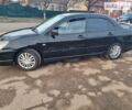 Чорний Міцубісі Lancer, об'ємом двигуна 2 л та пробігом 187 тис. км за 4800 $, фото 2 на Automoto.ua